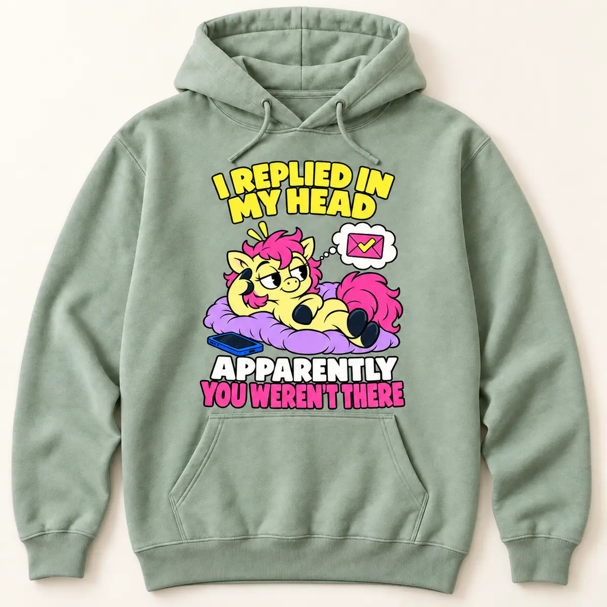 Sage green hoodie featuring the Little Liabilities Reply in My Head cartoon design: I REPLIED IN MY HEAD; APPARENTLY; YOU WEREN'T THERE; light yellow pony with a pink mane reclining on a purple cushion